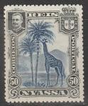 Ньяса (Португальский Мозамбик) 1901 год. Король Карлуш I. Жираф под пальмами, 1 марка из серии (наклейка)