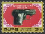 КНДР 2004 год. Пистолет Ким Чен Сук, жены Ким Ир Сена, 1 марка.