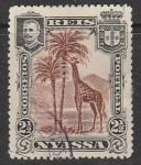 Ньяса (Португальский Мозамбик) 1901 год. Король Карлуш I. Жираф под пальмами, ном. 2,5; 1 марка из серии (гашёная)